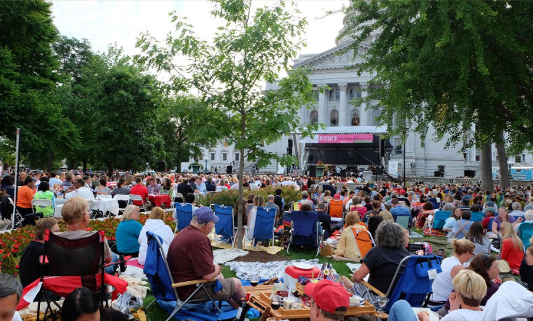 people sitting on blankets and chairs for Concerts on the Square