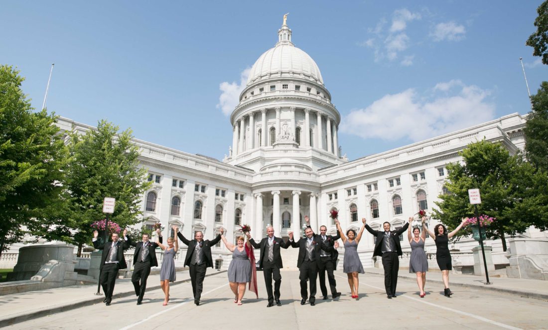 Grooms and wedding party in front of State Capitol in Madison WI