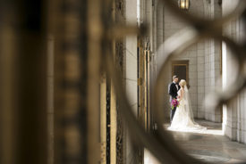 Wedding couple standing at the State Capitol in Madison WI